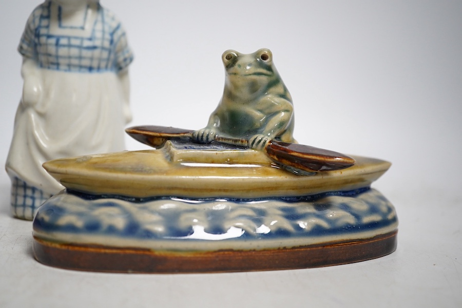 A Doulton Lambeth Kookaburra bibelot with silver tray, a novelty frog in a kayak, a fish jar and figure of a maid, Kookaburra 11cm high. Condition - good